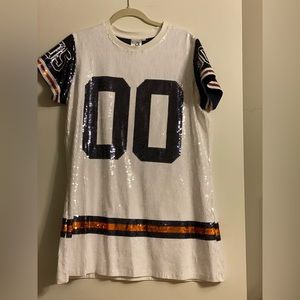 Queen of Sparkles white sequin jersey dress with orange and navy.